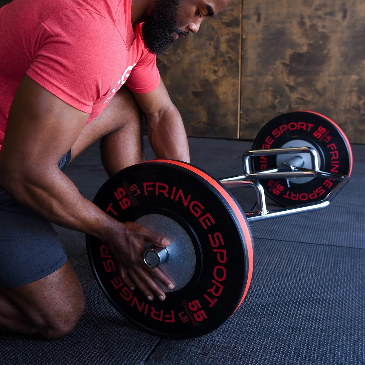 Olympic plates loaded on the Fringe Sport Hex Bar sleeve