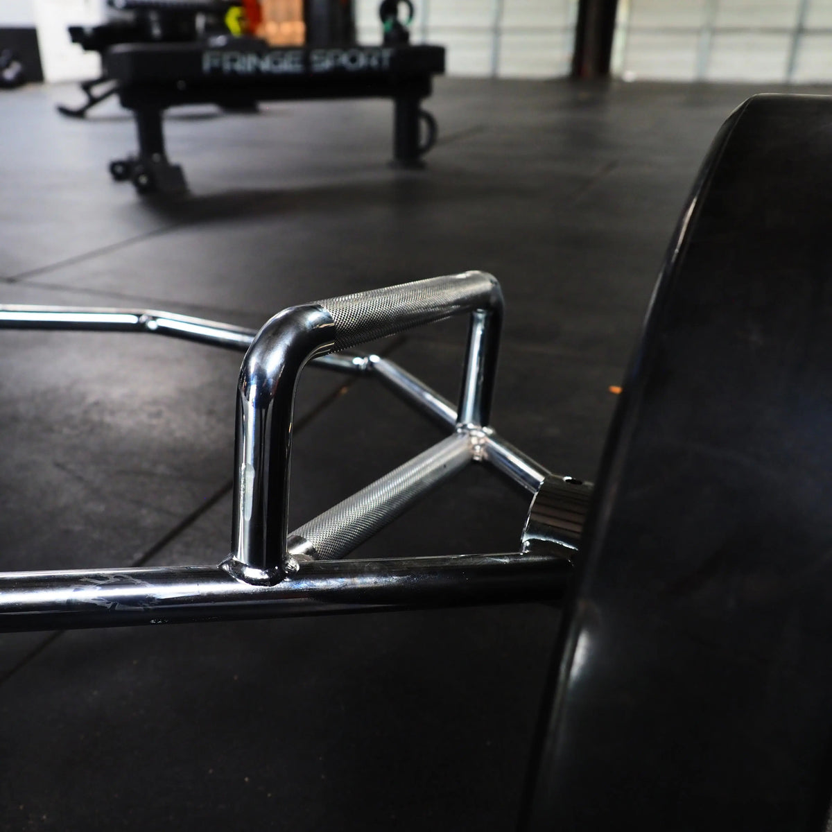 Close view of a knurled handle on the Fringe Sport Hex Bar