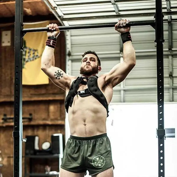 Athlete training pull-ups while wearing the fixed 20 lb WODmaster Weight Vest