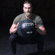man squatting with medicine ball (4767820996)